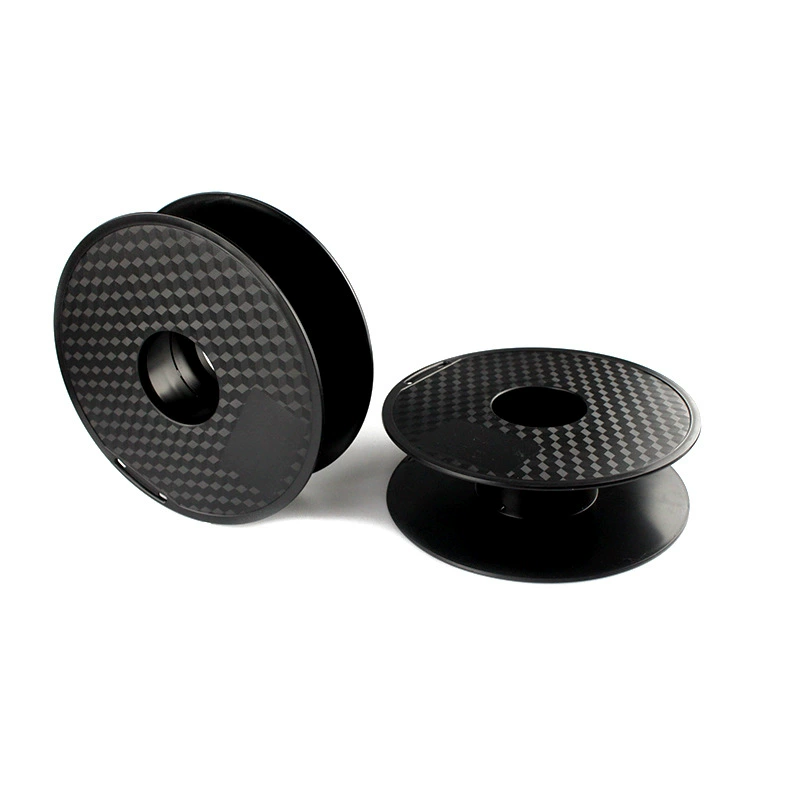 Two original textured black empty filament spools